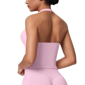 Pink seamless halter-neck sports top showing backless design for yoga and fitness