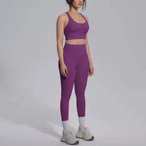 Side view detail of a purple seamless yoga set with sports bra and high-waisted leggings.