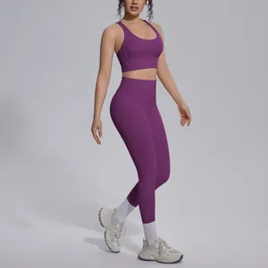 Full view of purple two-piece yoga set featuring sports bra and high-waisted leggings