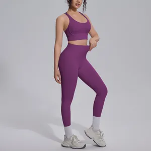Professional purple two-piece yoga set with high waist leggings and sports bra detail
