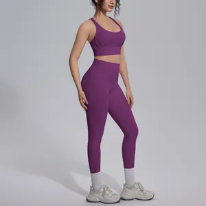 Side view detail of purple workout set with high-waisted leggings and sports bra