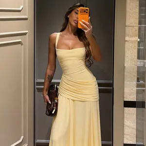 Elegant yellow sleeveless long evening dress with waist ruching and slim fit design.