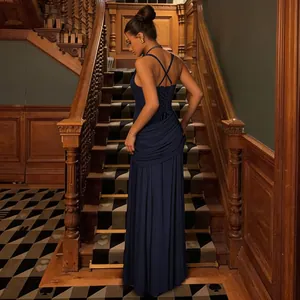 Detailed rear view of navy blue maxi gown showing criss-cross lace-up back and draped hip