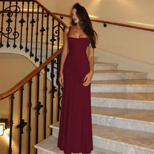 Elegant burgundy sleeveless floor-length evening dress with ruched waist detail on model