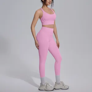 Full side view of pink seamless yoga set showing high-waist leggings and sports bra fit