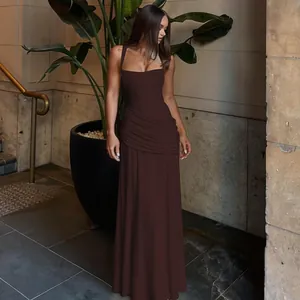 Detailed view of dark brown sleeveless evening gown with ruched side and slim fit design