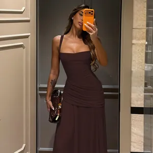 Detailed view of an elegant dark brown sleeveless ruched bodycon maxi dress for evening events.