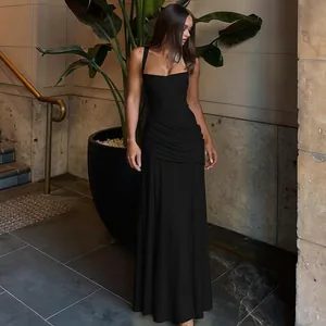 Elegant black sleeveless evening gown featuring a ruched waist and floor-length skirt