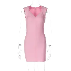 Detail shot of a pink V-neck sleeveless bodycon bandage dress with textured fabric.