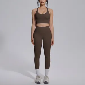 Full body view of a chocolate brown nylon yoga set featuring bodycon leggings and bra