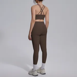 Back view of professional brown criss-cross sports bra and high-waisted leggings set