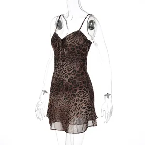 Detail of a leopard print chiffon camisole mini dress with a sexy V-neck design.