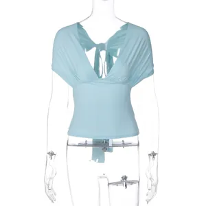 Elegant light blue deep V-neck shawl style top featuring a high waist and backless tie detail