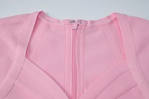High-quality close-up showing the hidden zipper and hook detail of a pink bandage dress