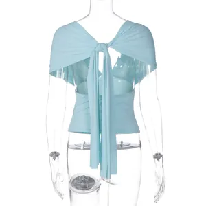 Detailed back view of a light blue women's deep V-neck top featuring a tie-back shawl design