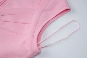 Close-up detail of premium pink bandage dress fabric texture and neat stitching