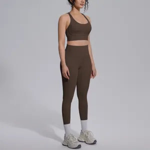 Full view of chocolate brown high-waist yoga set on a model in a studio setting.