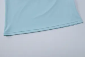 Close-up detail of the fine stitching and blue fabric on a stylish v-neck summer top