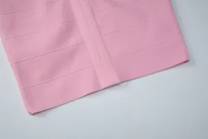 Detailed close-up of a pink bandage dress highlighting the high-quality ribbed fabric texture