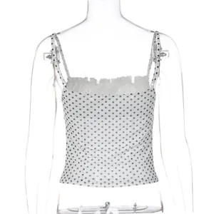 Back view detail of a slim fit white polka dot camisole crop top for women in sweet style