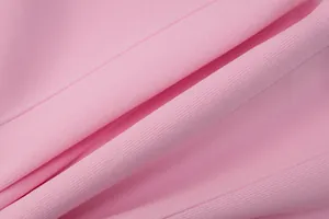 Detailed macro shot of the high-quality pink fabric texture for this elegant slim-fit dress.