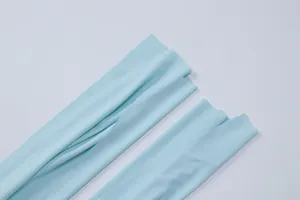 Detail view of soft light blue fabric for summer tie-front short sleeve top