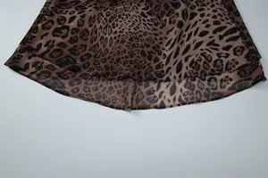 Macro view showing the double-layered leopard print chiffon hem of a sexy mini dress