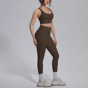 Detailed side view of professional dark brown high-waist yoga leggings and sports bra set