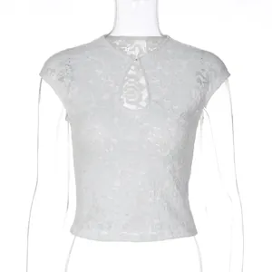 Close-up of white lace cropped top with elegant keyhole cutout design