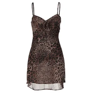 A detail view of this sexy leopard print chiffon mini dress with spaghetti straps.