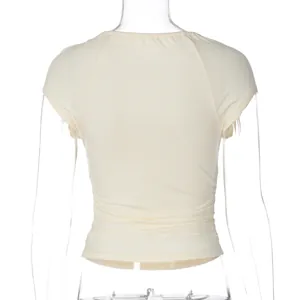 Detailed rear view of a cream-colored slim fit T-shirt featuring elegant gathered waist