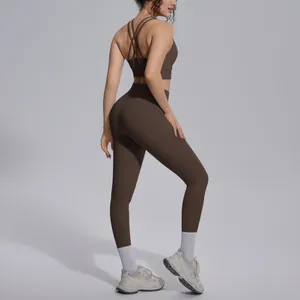 Back view of brown two-piece yoga set with criss-cross sports bra and high-waisted leggings