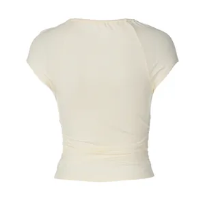 Back view of cream slim fit t-shirt showing elegant waist ruching details