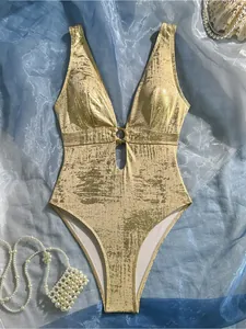 Elegant metallic gold one-piece swimsuit with sexy deep V-neck and cutout ring detail