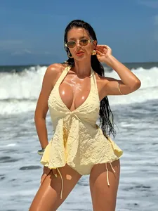 Close-up of pale yellow tankini featuring ruffled textured fabric and halter design