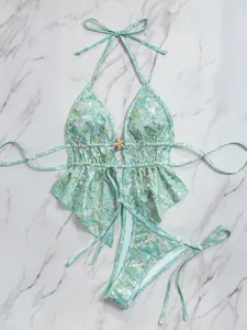 Mintgroen bloemen pailletten tweedelig badpak met zeester detail en halterbandjes