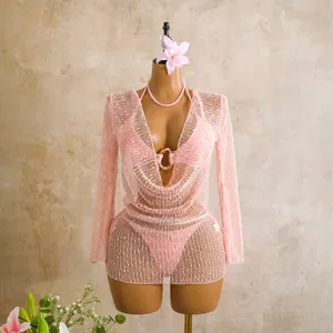Detail presentation of pink sequined mesh three-piece bikini swimwear set on mannequin