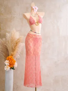 Detailed full view of pink lace mesh 3-piece swimwear with long skirt on mannequin