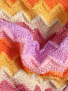 Macro view of colorful gradient striped crochet knit fabric texture for summer bikini
