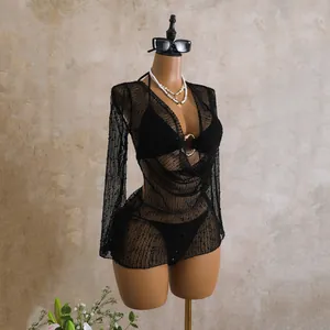 Close-up view of elegant black sequined mesh cowl neck long sleeve bikini cover-up