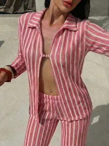 Detailed macro view showing the pink and white striped mesh texture of this beachwear set