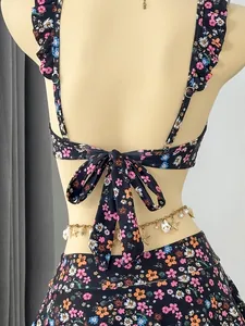 Detailed back view of a floral ruffle bikini top featuring an elegant large self-tie bow