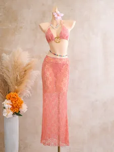 Elegant pink lace three-piece bikini set featuring a sheer mesh long skirt for beach