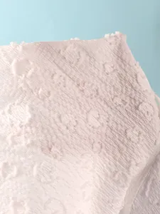 Close-up macro view of white floral textured special fabric for sexy bikini swimsuit