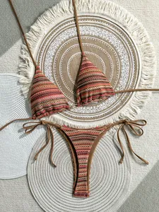 Detailed view of the bohemian striped knit texture on a triangle bikini top and bottom