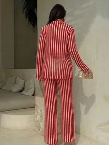 Rear view of elegant red and white vertical striped knit top and pants beach set
