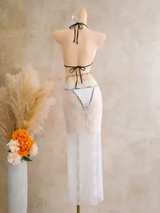 Detailed back view of sexy white lace mesh maxi skirt and matching bikini bottom