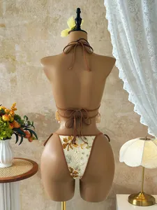 Back view of a sequined floral bikini set on a mannequin for beach resort style.