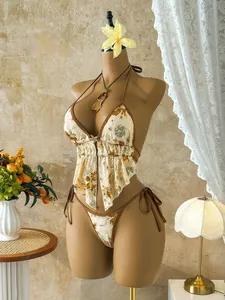 Elegant two-piece sequined floral bikini set for beach vacation shown on a mannequin