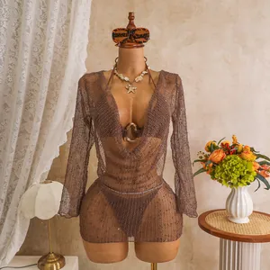 Close-up detail of a brown three-piece mesh bikini set with sparkling sequins on a mannequin